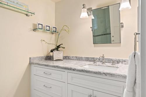 a bathroom with a sink and a mirror at Malibu Dunes by Fieldtrip Expansive Hamptons-Style Estate w Private Beach Backyard in Malibu