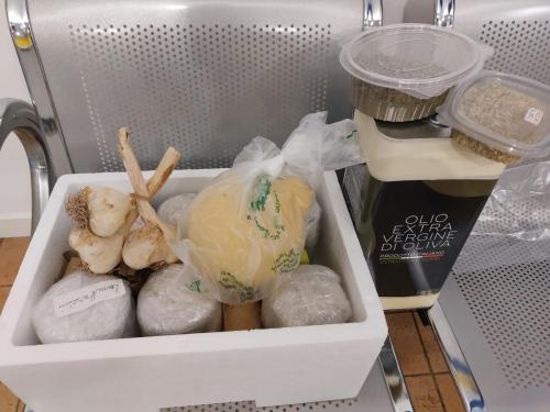 a white drawer in a refrigerator filled with vegetables at Tina's House in Barletta