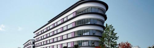 a tall white building with a lot of windows at Hotel Indigo Torquay, By IHG in Torquay