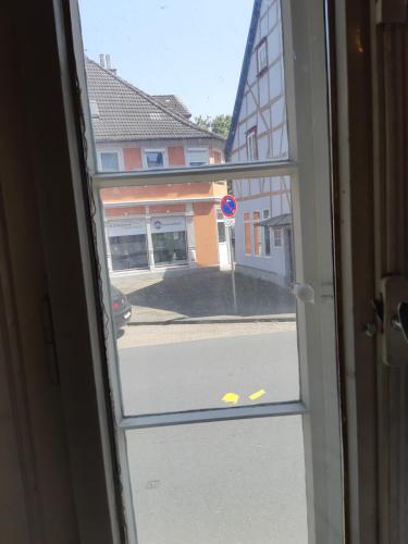 a view of a street through a window at Villa de Weser Hameln in Hameln