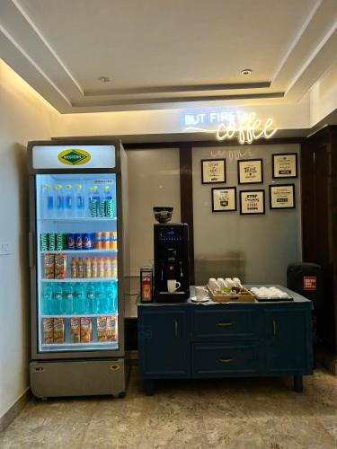 a refrigerator filled with lots of bottles of water at Vaydantaa - Luxury Boutique Resort Mussoorie in Mussoorie