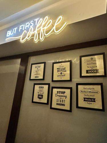 a sign on the wall of a fast food restaurant at Vaydantaa - Luxury Boutique Resort Mussoorie in Mussoorie