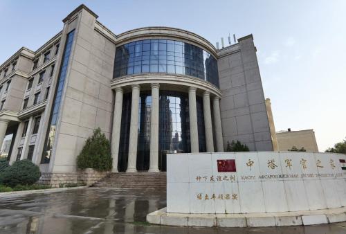 a building with a sign in front of it at Kohi Afsaron in Dushanbe