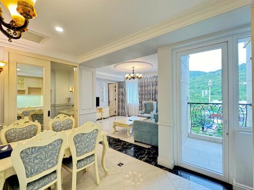a dining room with a table and chairs at Lan Rung Beach Resort in Long Hai