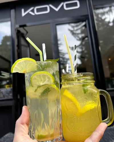 a person holding two glasses of lemonade at Hotel Etropol, Center Etropole in Etropole