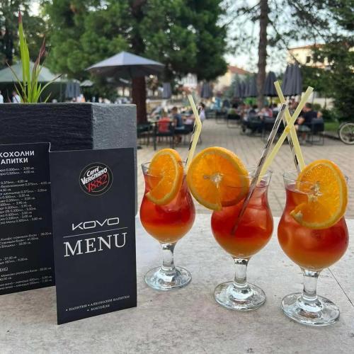 a group of four glasses with orange slices in them at Hotel Etropol, Center Etropole in Etropole