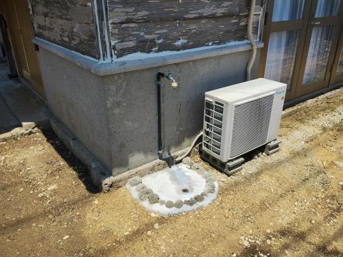 an air conditioner next to a building with a heater at Unwind DAY OFF Nagamo in Yaese