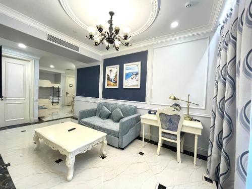a living room with a couch and a table at Lan Rung Beach Resort in Long Hai