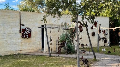 a wall with a bunch of shoes on it at Roy's Rest Camp in Groutfontein