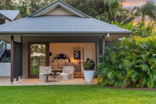 a gazebo with a couch and chairs on a deck at Tranquil Byron Bay Villa, Hinterland views - Vue 3 in Ewingsdale