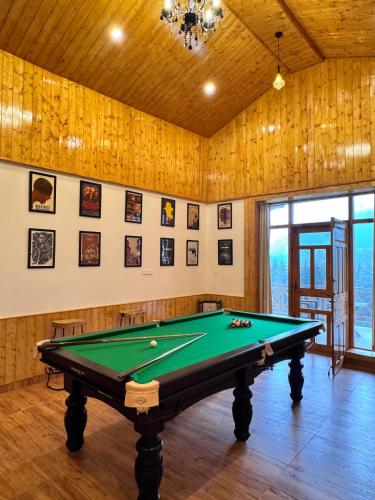 a billiard room with a pool table in it at The Highgrove House, Manali in Haripūr