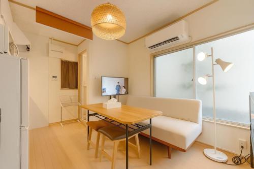 a room with a desk and a chair and a table at shibuya sakaraku-SY0027 in Tokyo