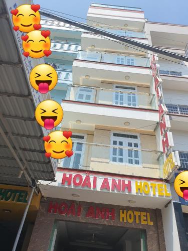 a hotel with hello kitty signs hanging over a building at Hotel Hoai Anh in Vung Tau