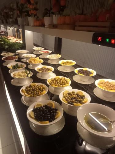 a buffet with many bowls of food on a table at Pamukkale Kaya Termal Otel in Pamukkale