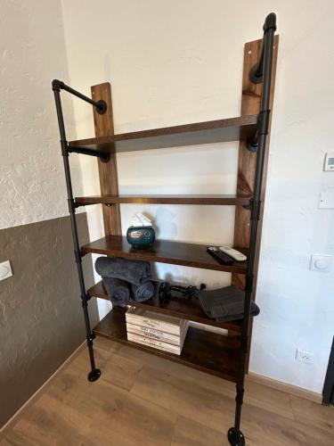 a wooden shelf in a room with a wall at Gite Clé des Champs in Montenois