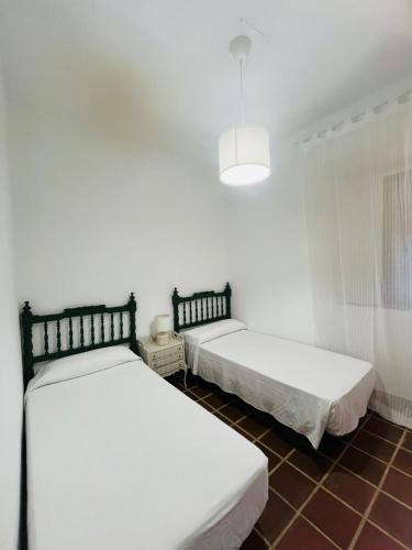Postel nebo postele na pokoji v ubytování Hotel Humaina