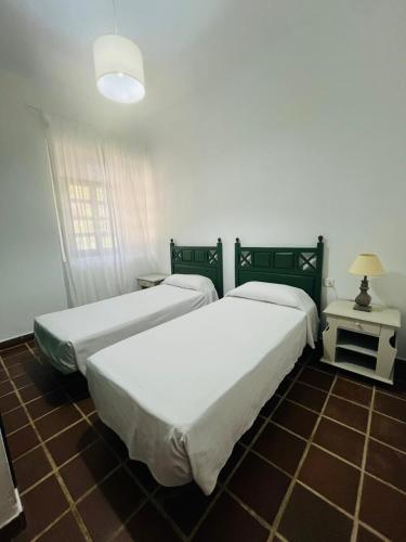 Postel nebo postele na pokoji v ubytování Hotel Humaina