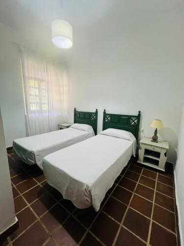 Postel nebo postele na pokoji v ubytování Hotel Humaina