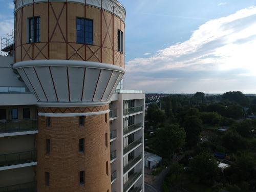 a control tower on the side of a building at Exklusives Wohnen im historischen Wasserturm dem Highlight von Delitzsch WE318 in Delitzsch