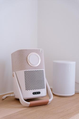 an old radio sitting on top of a wooden floor at La Brise Marine in Ostend
