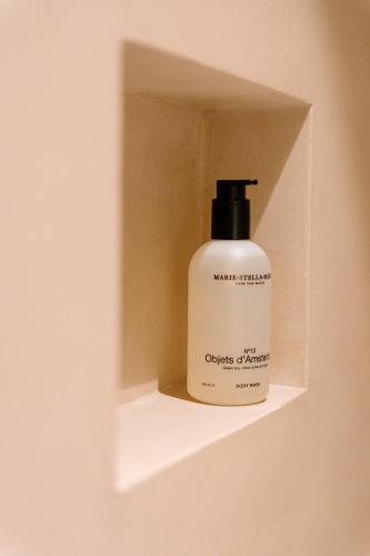 a bottle of antiperspirant on a shelf in a wall at La Brise Marine in Ostend