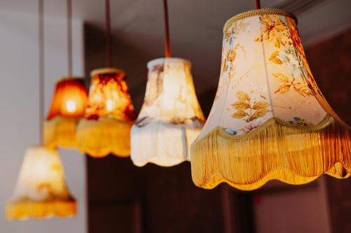 a group of nine chandeliers hanging from a ceiling at Residhome Nanterre La Défense in Nanterre