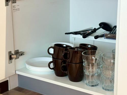 Tetera y cafetera en Neighbor's Hotel 西広島駅前