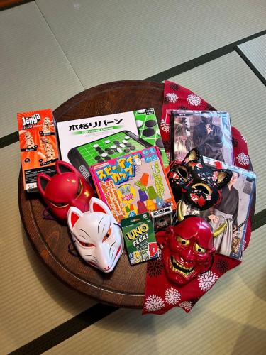 a table with toys and games on a plate at sukeemon in Biei