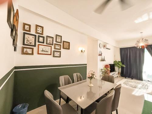 a dining room with a table and chairs at Ipoh The Cove Hillside Stay 7 to 10 pax, 5 min to Ipoh Town in Ipoh