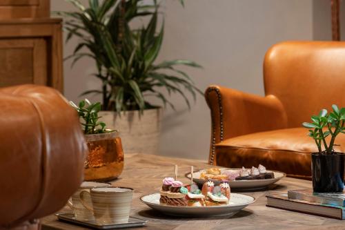 a table with two plates of food on it at Crowne Plaza Florya Istanbul by IHG in Istanbul