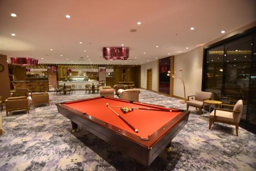 a pool table in the middle of a room at Crowne Plaza Florya Istanbul by IHG in Istanbul
