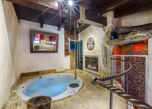 a large bathroom with a large tub in a room at Il Giardino dei Flintstones B&B in Cerveteri