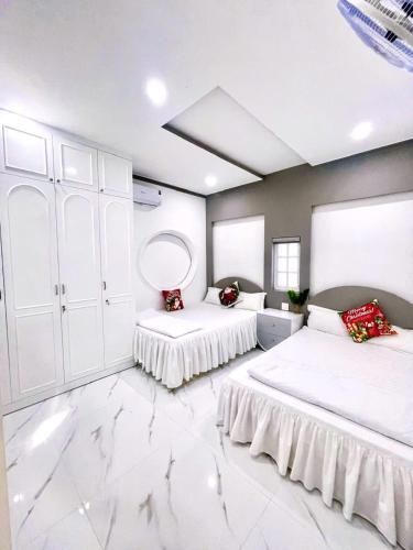 Ein Bett oder Betten in einem Zimmer der Unterkunft Hoàng Nga 1 Homestay