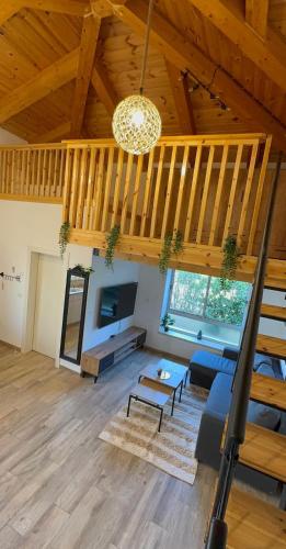 a large living room with a couch and a table at נופש בהגושרים in Hagoshrim