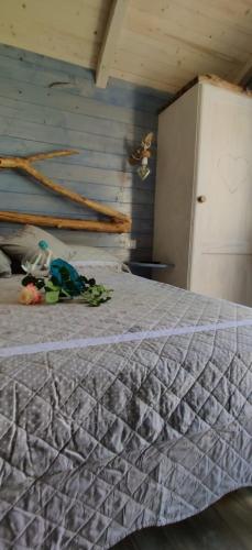 a bedroom with a bed and a refrigerator at Il Giardino dei Flintstones B&B in Cerveteri