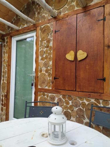 a table in a room with a wall with hearts on it at Il Giardino dei Flintstones B&B in Cerveteri