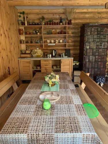 a kitchen with a table with a blanket on it at Яглина in Sprynya