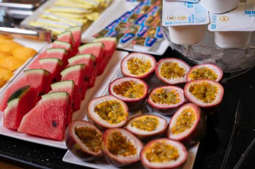 a plate with slices of fruit on a table at Crystal Holiday Ha Long Hotel in Ha Long