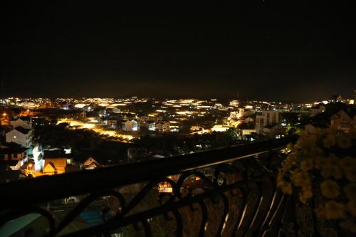 a view of a city lit up at night at The Grandview Villa Dalat in Da Lat