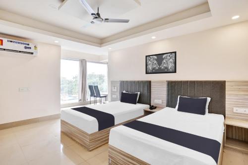 Ένα ή περισσότερα κρεβάτια σε δωμάτιο στο Hotel O Vira