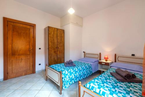 Postel nebo postele na pokoji v ubytování House Leoni