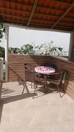 a table and two chairs on a patio at Recharge your batteries Arca da Aliança Chalet in Limeira