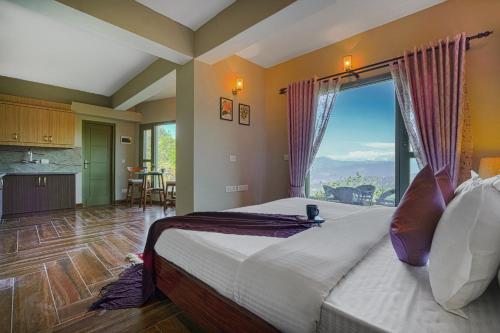 a bedroom with a large bed with a large window at SaffronStays Edelweiss Estate Amore in Chaubattia