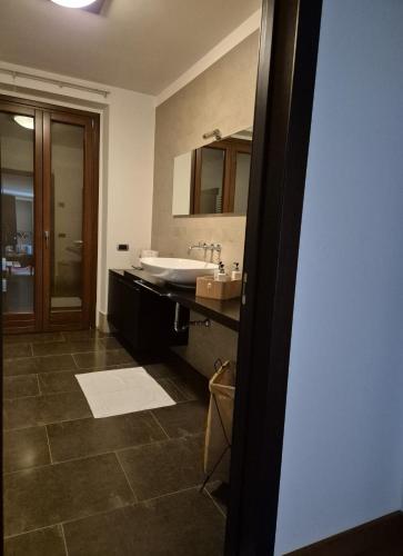 a bathroom with a sink and a mirror at Villa in Langa in Belvedere Langhe
