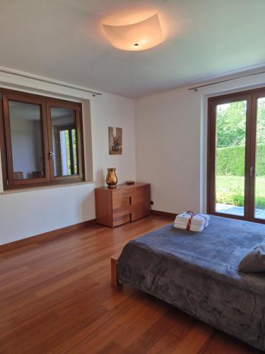 a bedroom with a large bed and a window at Villa in Langa in Belvedere Langhe