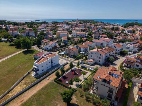 an aerial view of a city with houses at Apartments Hana in Funtana in Funtana