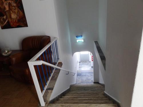a staircase in a house with a stair case at Residencial Espadinha in Quarteira