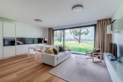 a living room with a couch and a table at Residenza Ticino by Quokka 360 - Modern Oasis near Bellinzona in Bellinzona
