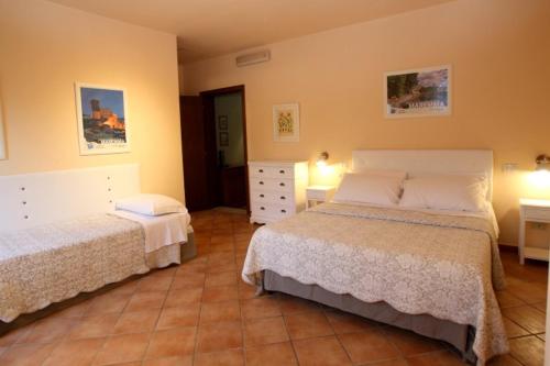Postel nebo postele na pokoji v ubytování Agriturismo Peretti