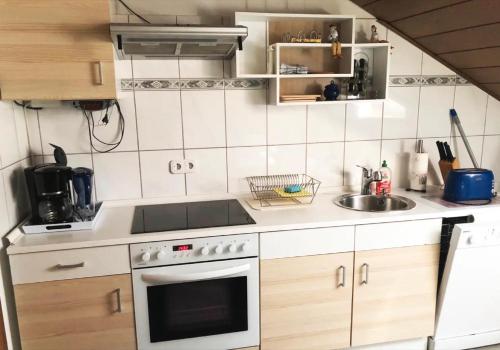 Η κουζίνα ή μικρή κουζίνα στο Ferienwohnung Tannhausen